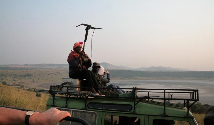 Rangers on vehicle with Telemetry equipment for monitoring lions (Queen Elizabeth NP Uganda)